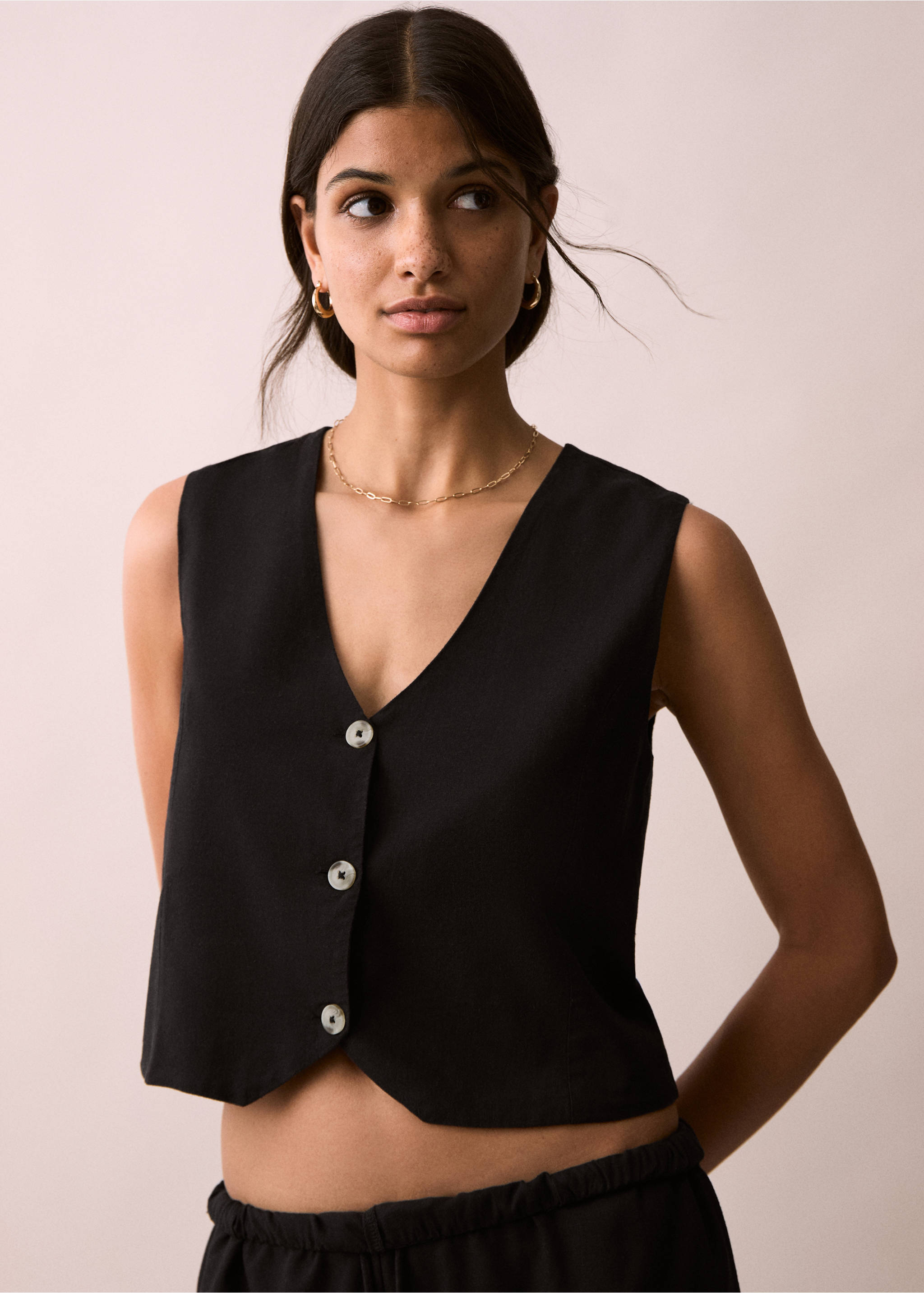 Armilla lli botons - Pla mig, Negre. Ref: 87076348-00.