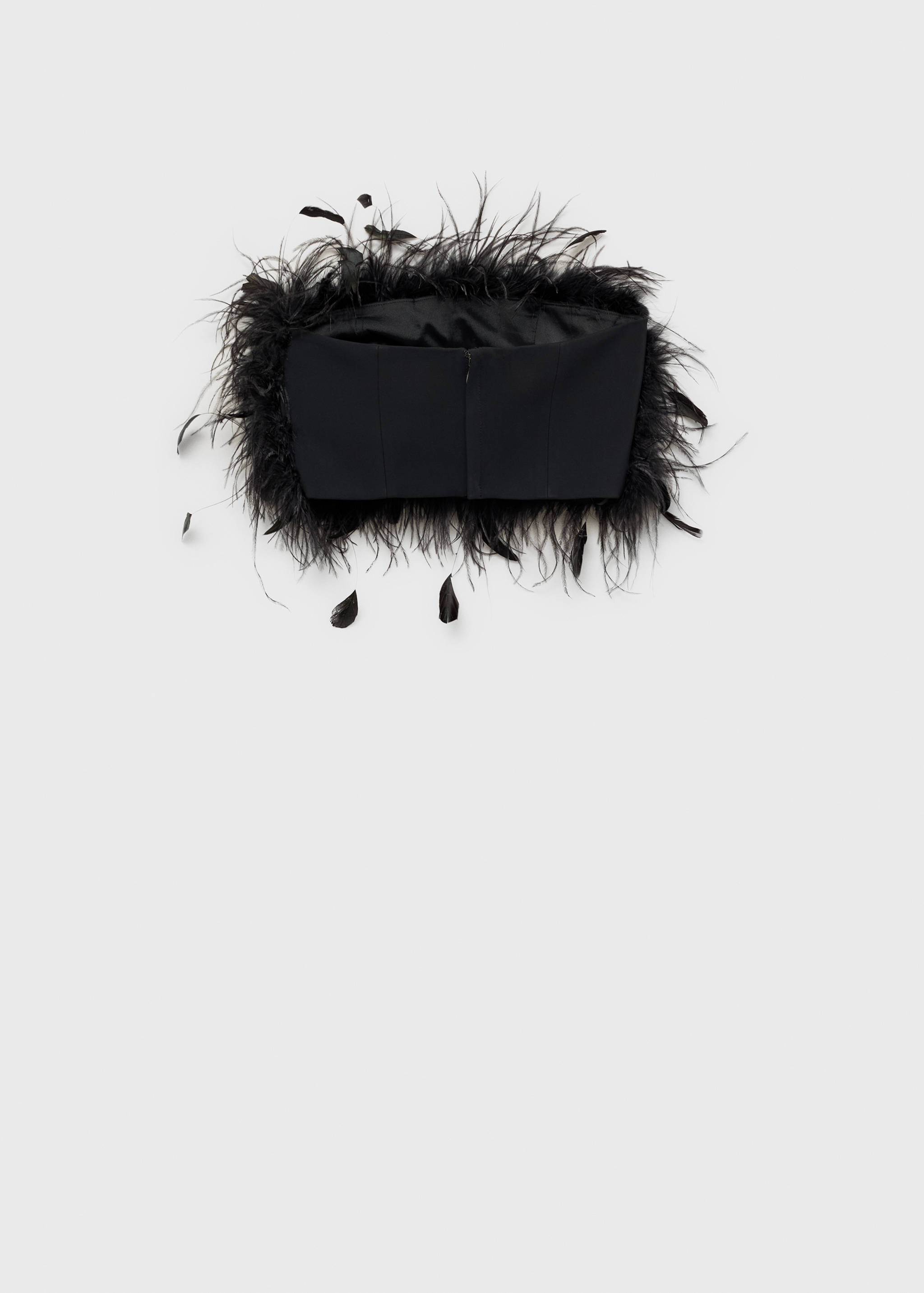 Black strapless top with feather trim in a still life view.