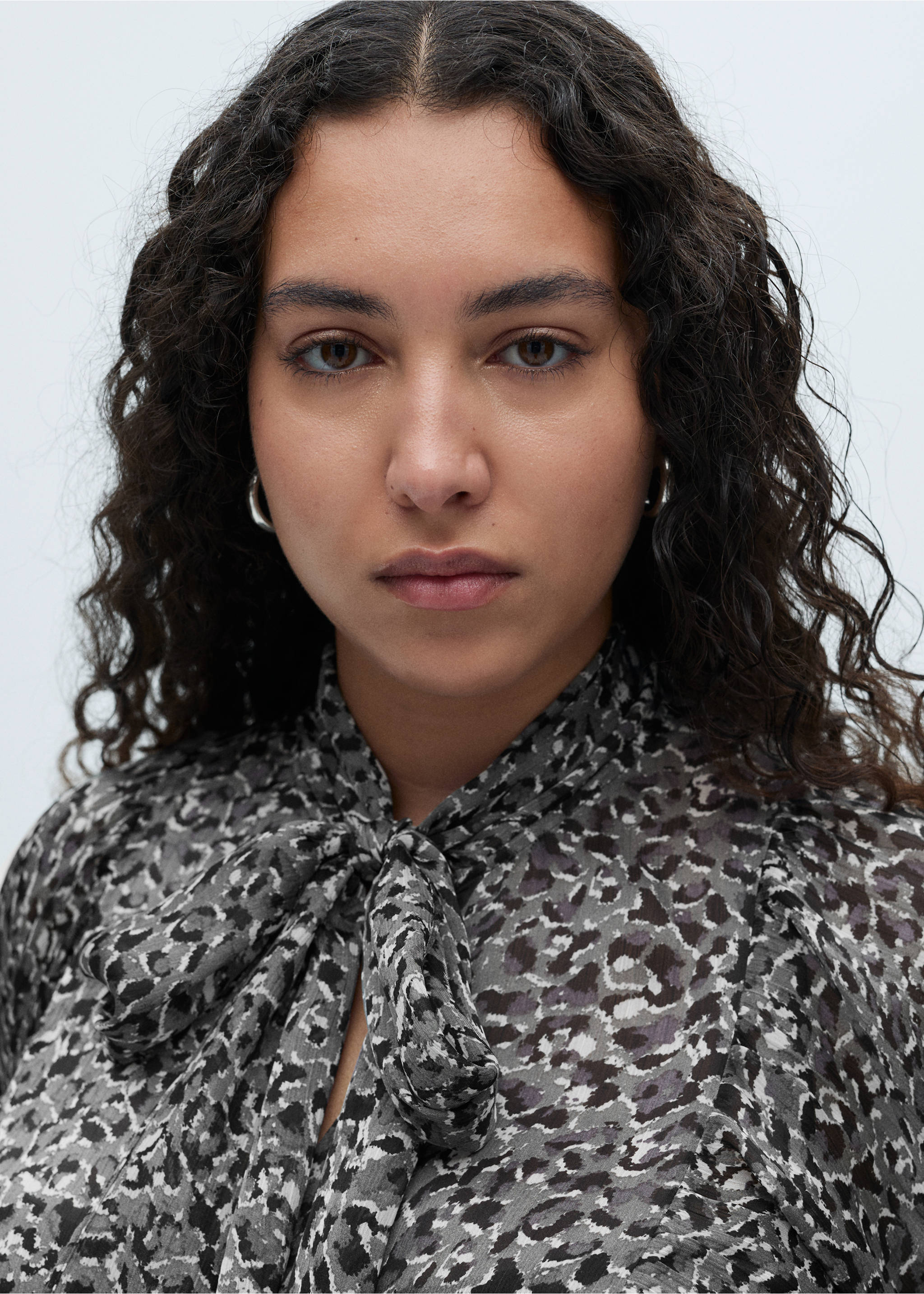 Animal-print blouse with bow neck - Details of the article 4, Black. Ref: 87080628-00.