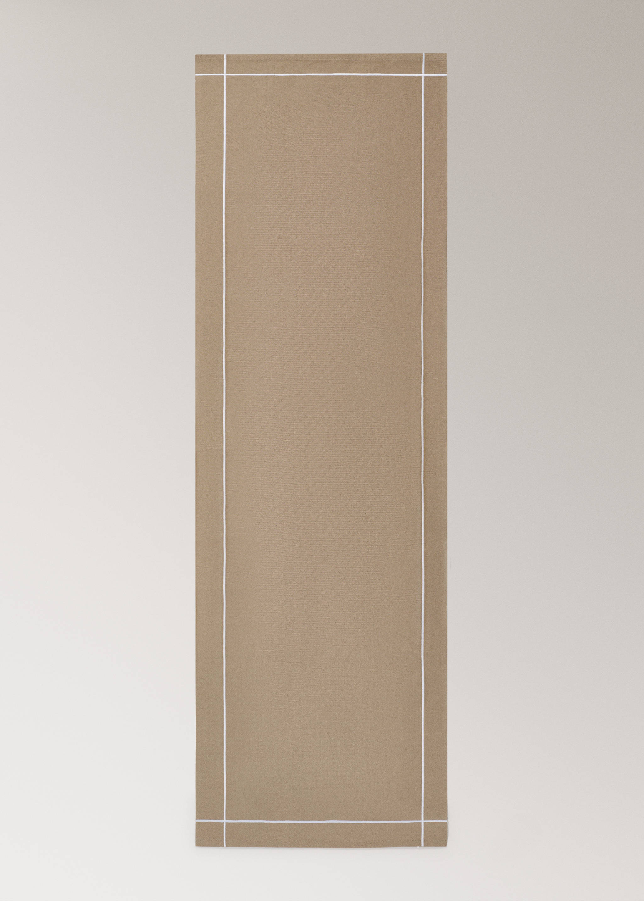 Beige table runner featuring an inset white border line.
