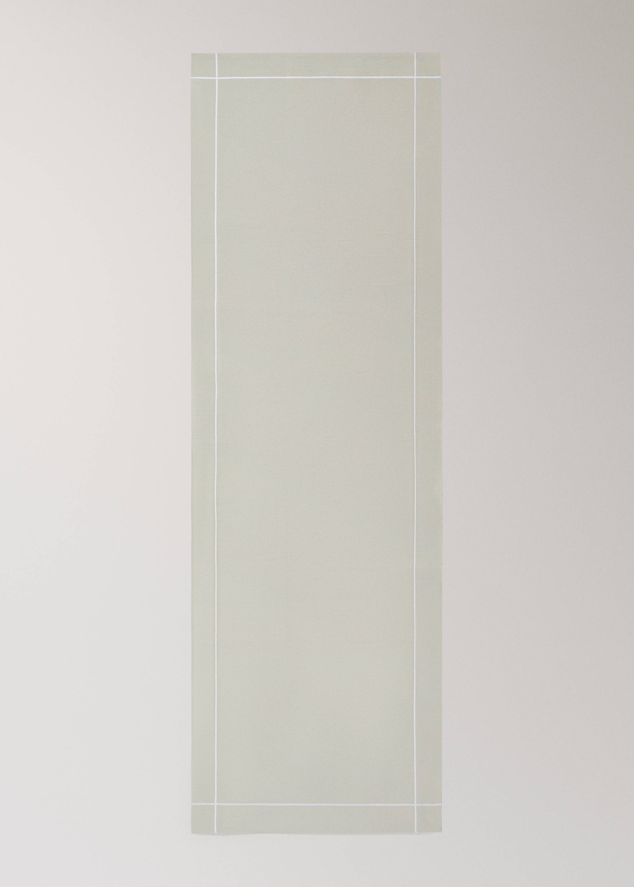 Light beige table runner with a contrasting white border line.