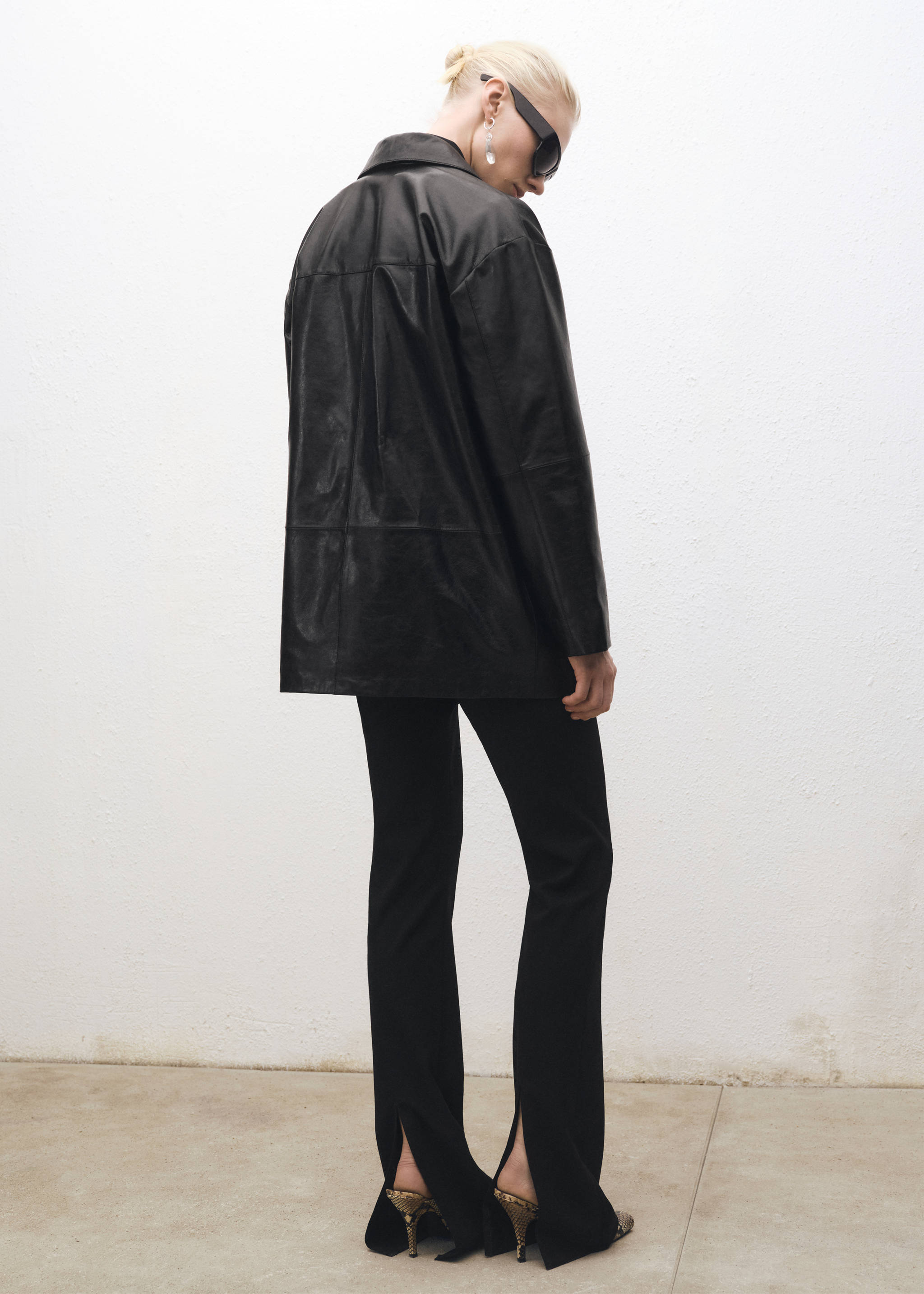 Flared suit pants with openings - Reverse of the article