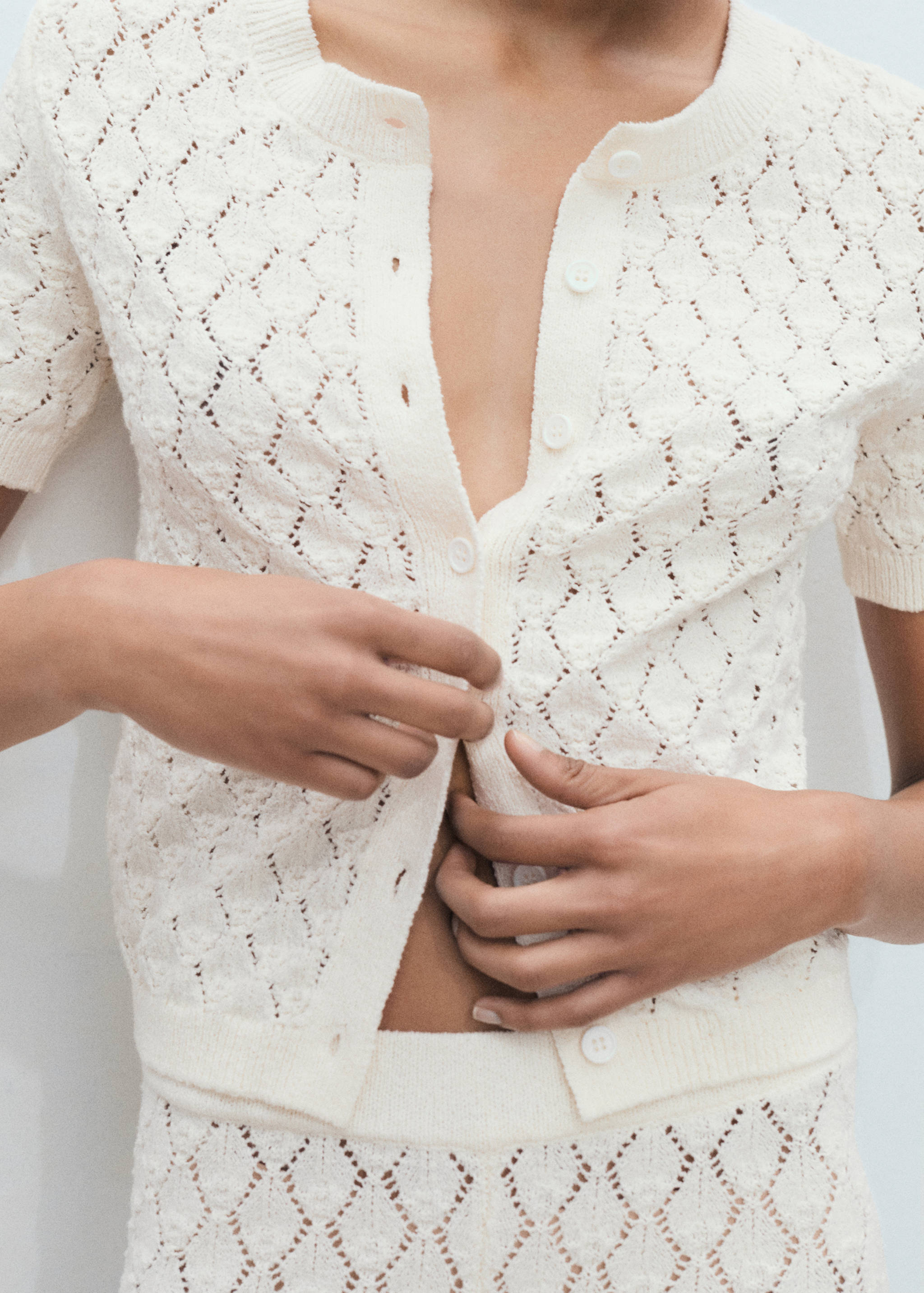 Short-sleeved knitted cardigan with lace design - Details of the article 6