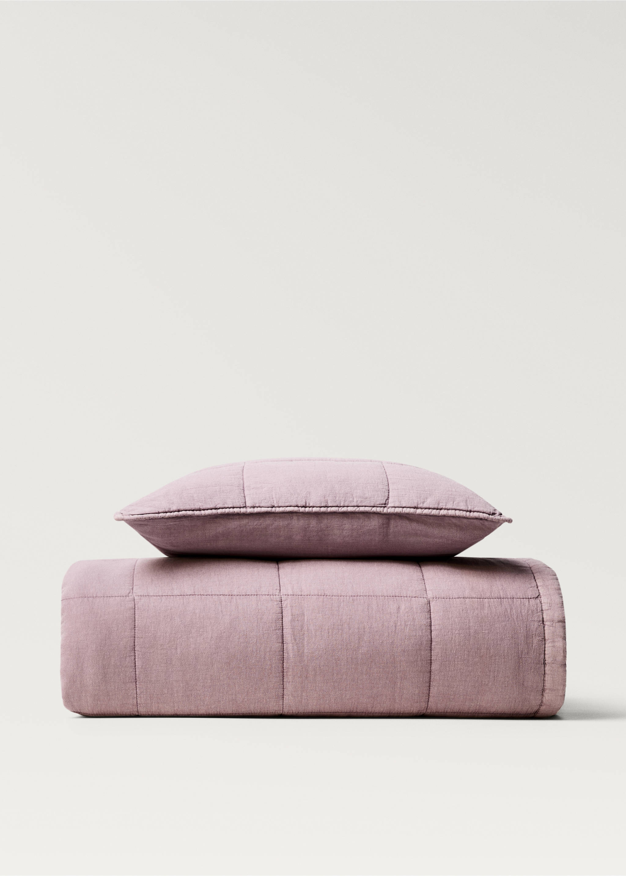 Mauve quilted bed cushion cover shown with matching bedding., Plum. Ref: 87092908-00.