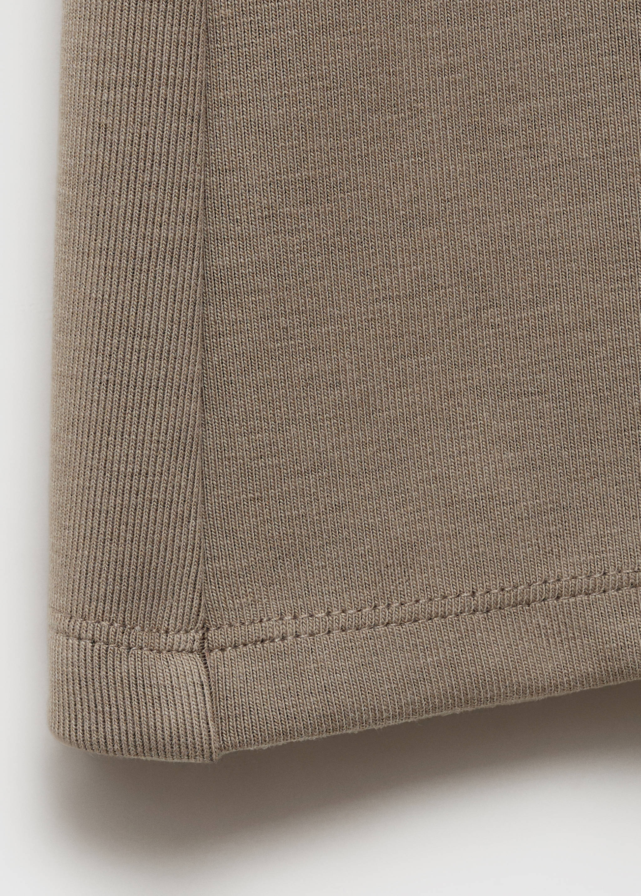 Calças de malha à boca de sino - Pormenor do artigo 8