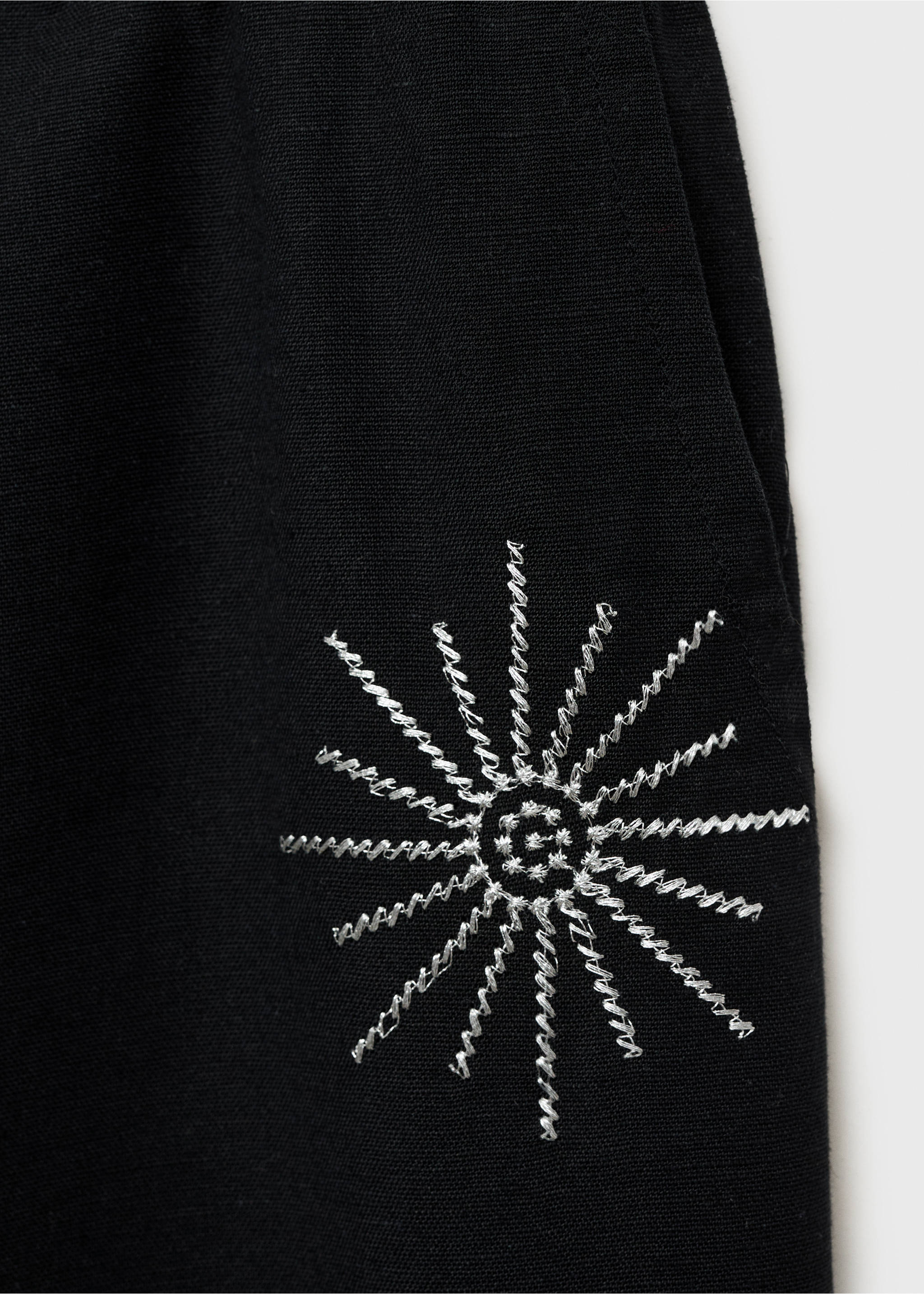 Long trousers with embroidered details - Details of the article 0, Black. Ref: 87095725-00.