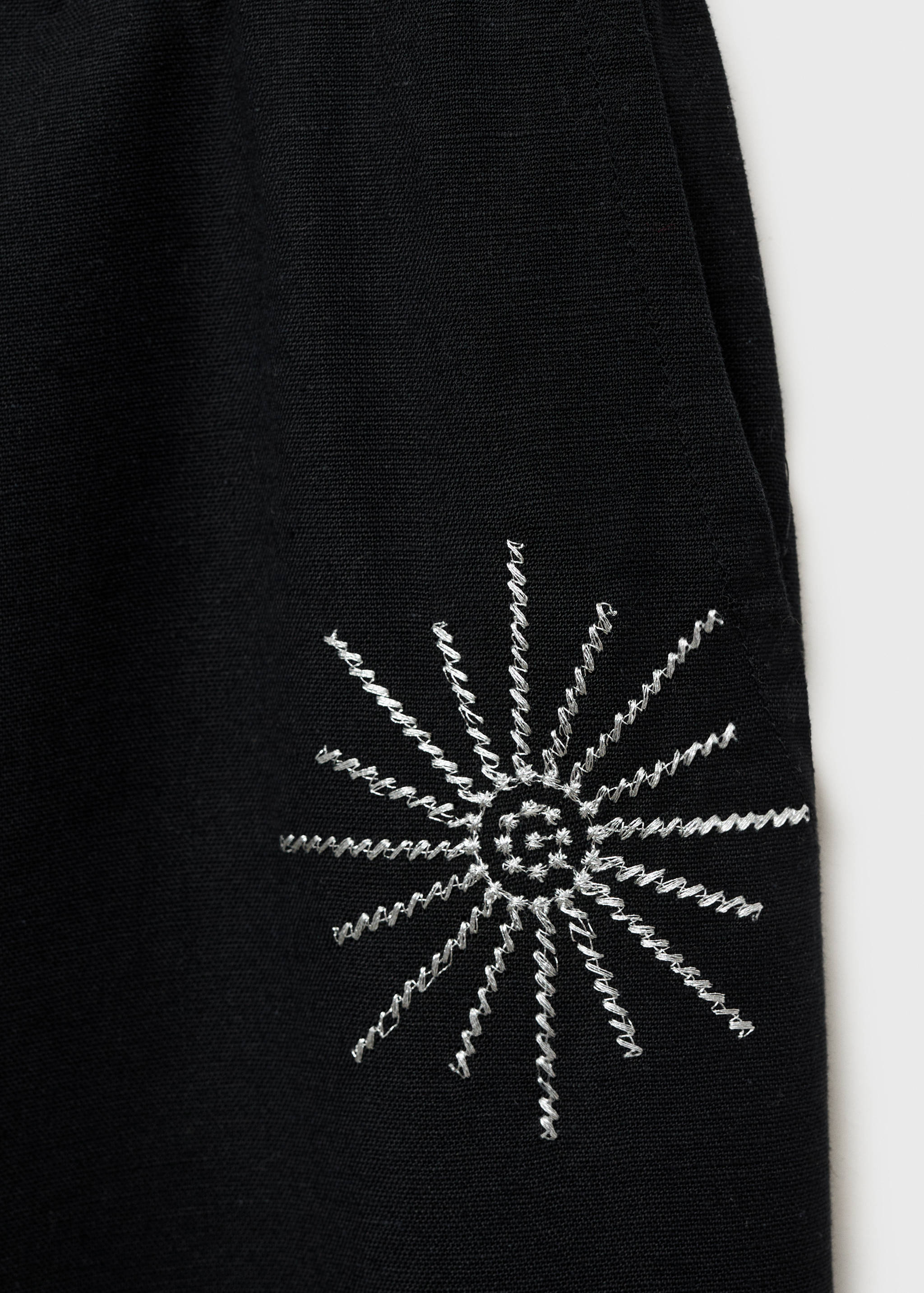 Long trousers with embroidered details - Details of the article 0