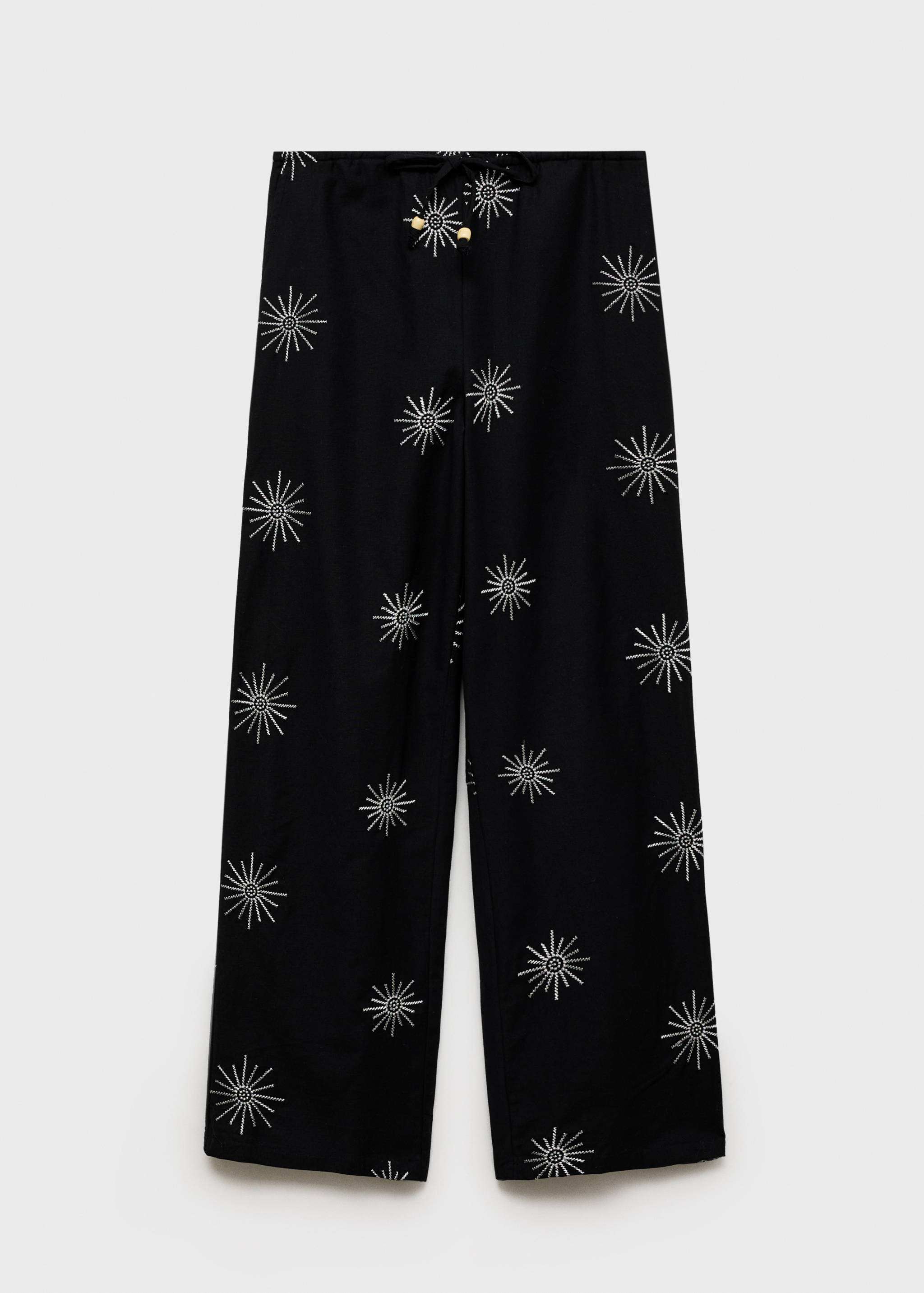 Long trousers with embroidered details - Article without model