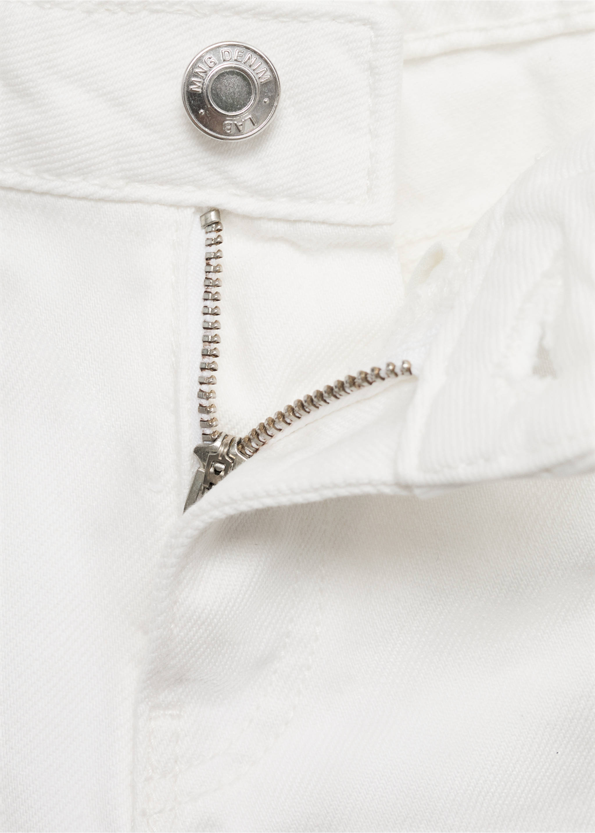 Close-up of white denim bermuda shorts fly and button detail., White. Ref: 87097701-00.