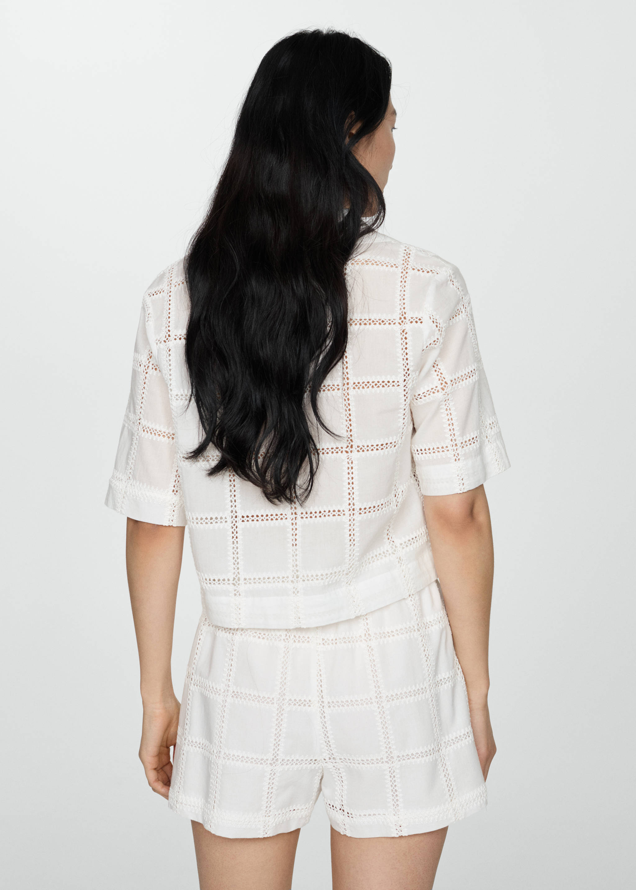 Embroidered polo-neck blouse - Reverse of the article